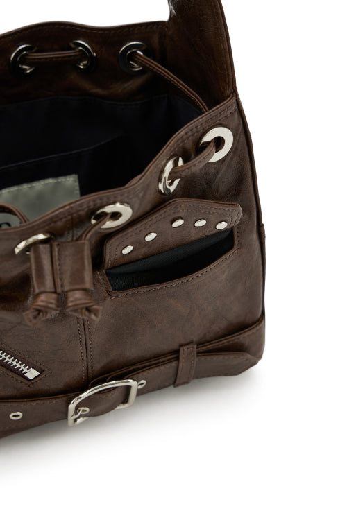 DEINET STUD BELTED MINI BUCKET BAG IN BROWN